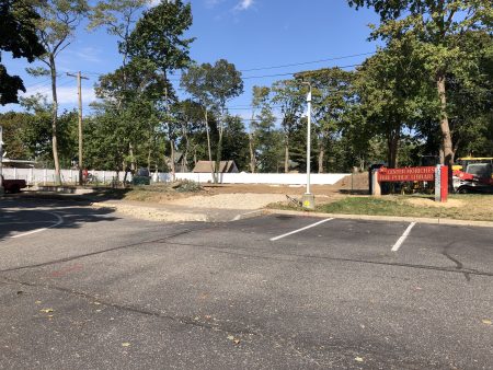 photo of fence installation in construction site.