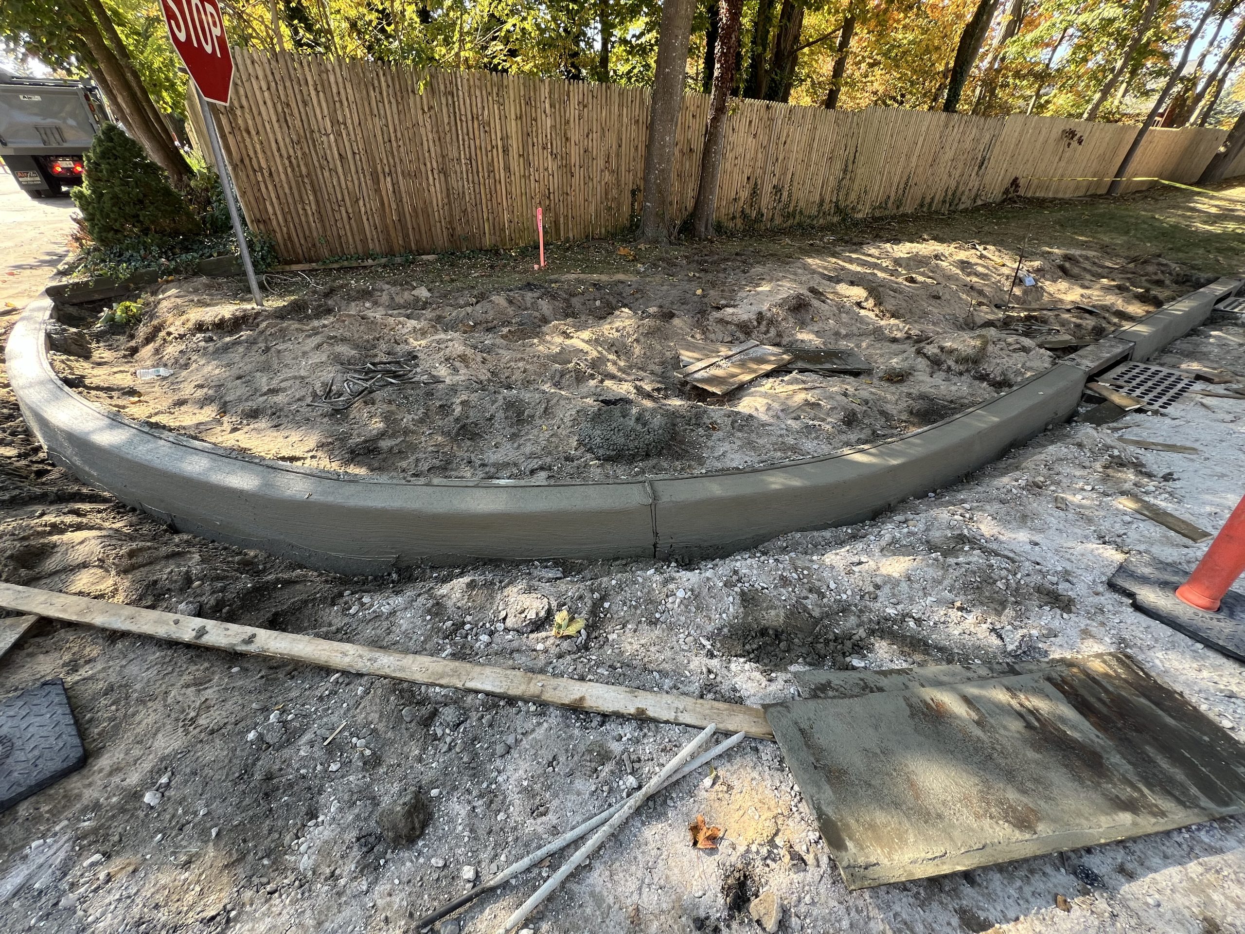 new curb installed off of Railroad Ave entrance