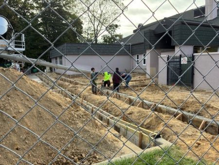 Concrete forms for the curbs around the community garden